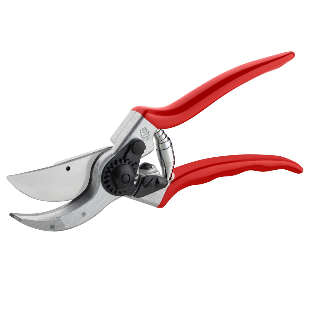 The Felco 2: forged aluminium handles, hardened steel blade, riveted anvil and a wire-cutting notch. A pro favourite for decades, every part replaceable.